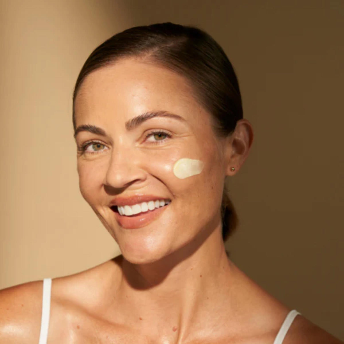 ALASTIN Skincare A-LUMINATE Brightening Serum shown on model